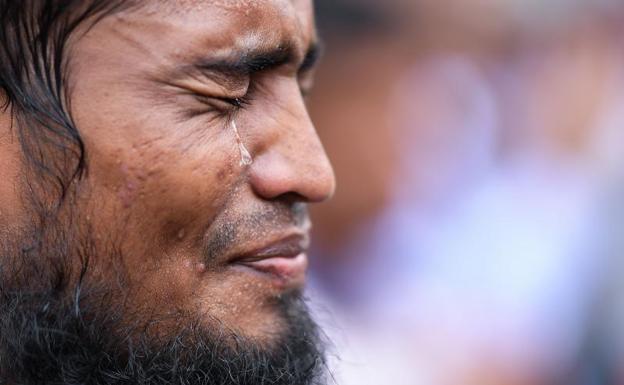 Un refugiado, llorando./Afp